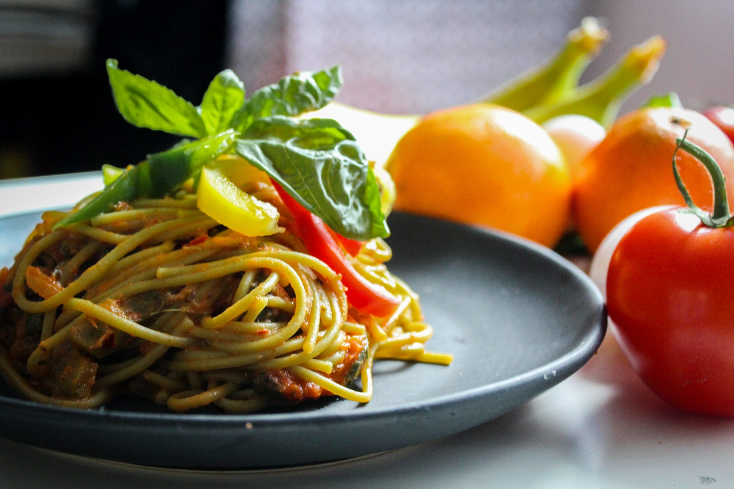 A spaghetti with a tomato.