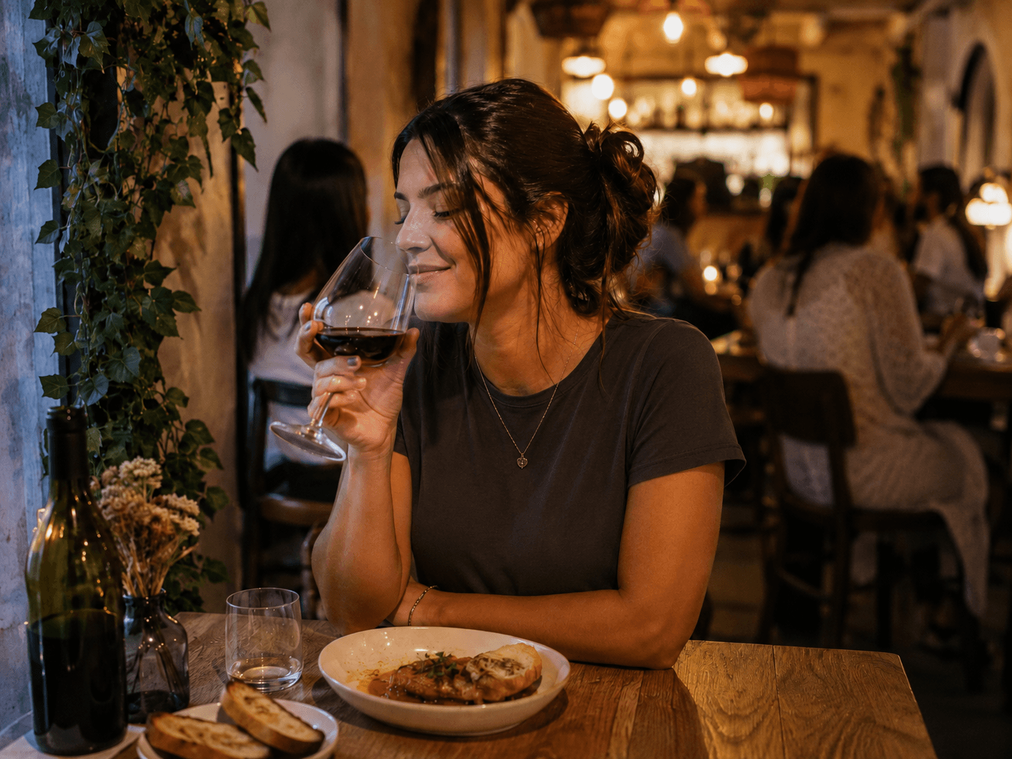 Woman Enjoying Wine Alone in a Cozy Restaurant